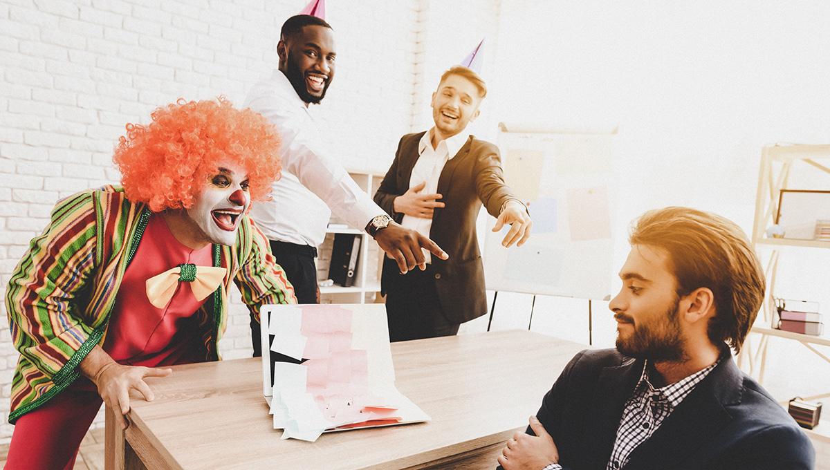 Article Cards Featured Image Young Man in Clown Costume on Meeting in Office.